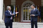 Alberto Fernandez speaks to Pedro Sanchez at the Moncloa Palace in Madrid, on May 11.