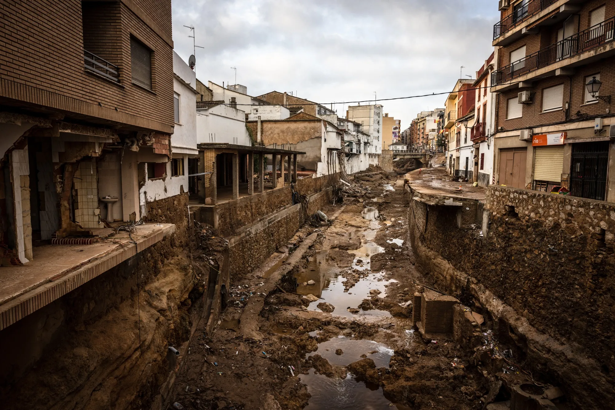 Homes beside a riverbed destroyed after flash floods in Chiva, Spain, in 2024.