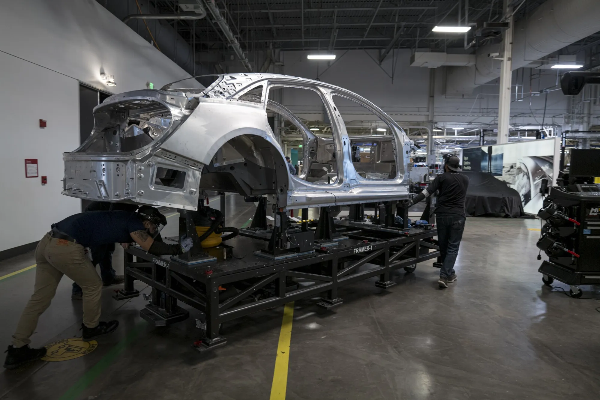 Workers assemble a Lucid Group Inc. electric vehicle at the company's facility&nbsp;in Newark, California.