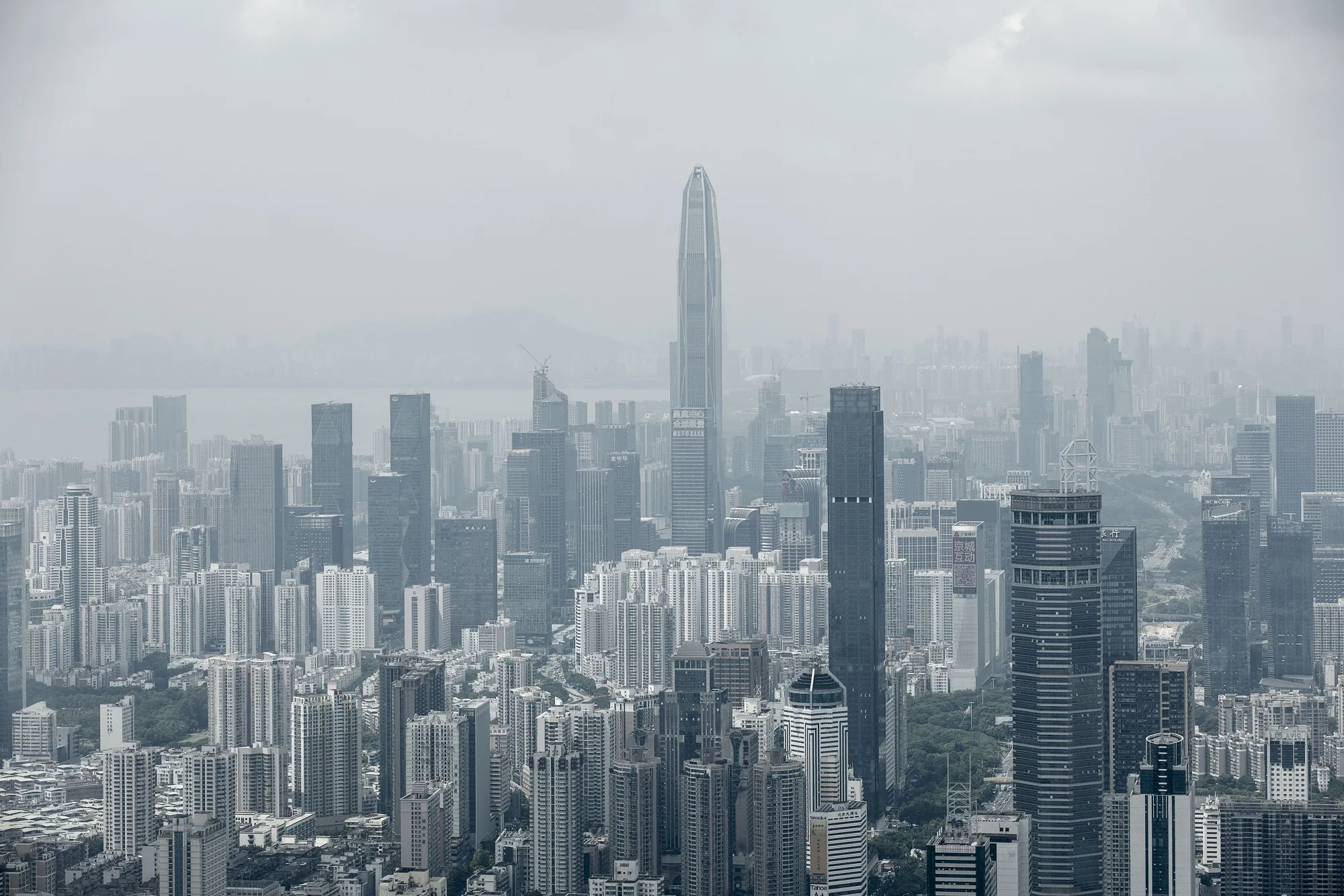 The Ping An International Finance Center (Ping An IFC), center, stands among commercial and residential buildings in Shenzhen, China, on Wednesday, Sept. 20, 2017. China is on a city-by-city campaign to rein in house prices and limit the risk of bubbles.