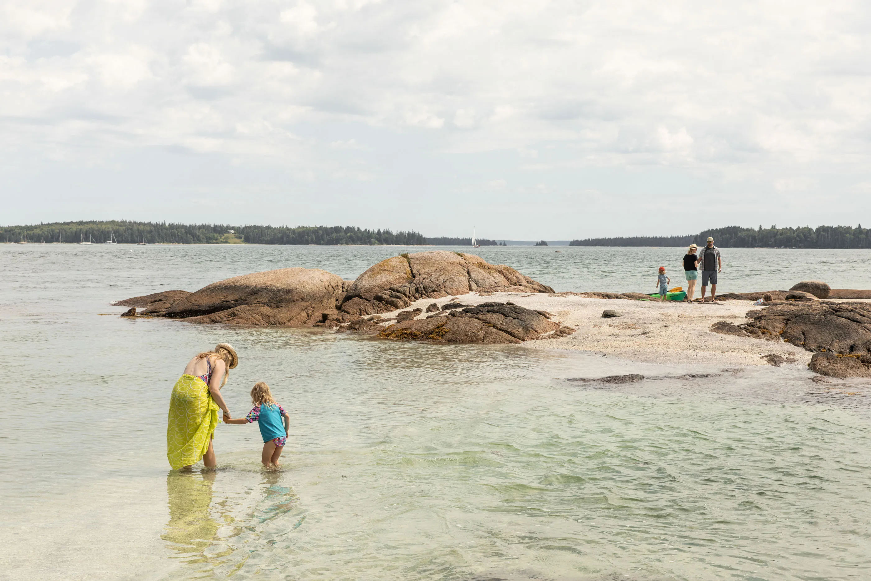Families brave the chilly waters on a&nbsp;beach in Blue Hill.&nbsp; &nbsp;
