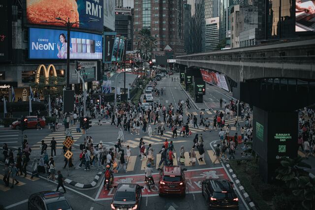 Pedestrians cross the streets in Bukit Bintang business area in Kuala Lumpur, Malaysia, on June 1, 2025. Photographer: Samsul Said/Bloomberg