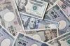 Japanese yen and U.S. dollar banknotes are arranged for a photograph in Tokyo, Japan on Sunday April 14, 2019. U.S. Treasury Secretary Steven Mnuchin said he wanted a currency clause in a trade deal with Japan to prevent deliberate manipulation of the yen to bolster exports, Japanese public broadcaster NHK said.