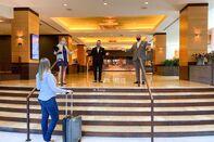 relates to Luxury Hotels Face New Conundrum: Offering Service Without the Smile