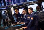 Traders work on the floor of the New York Stock Exchange (NYSE) in New York, U.S.