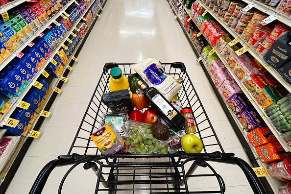 This illustration shows a shopping cart with items that could be affected by tariffs at a store in Annapolis, Maryland, on April 4, 2025. Markets extended a global selloff on April 4 as countries around the world reeled from US President Donald Trump's trade war, but the White House insisted the American economy will emerge victorious. Shock waves tore through markets in the United States, Europe and Asia after Trump's tariff bombshell, as foreign leaders signaled readiness to negotiate but also threatened counter-tariffs. (Photo by Jim WATSON / AFP) (Photo by JIM WATSON/AFP via Getty Images)