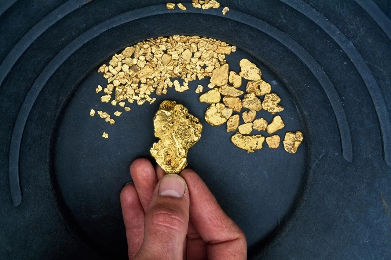 Panning for gold, which recently saw its value plummet. Photographer: Altrendo/Getty Images