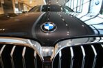 The hood and grille of a BMW 318D inside a BMW AG showroom in Berlin, Germany.