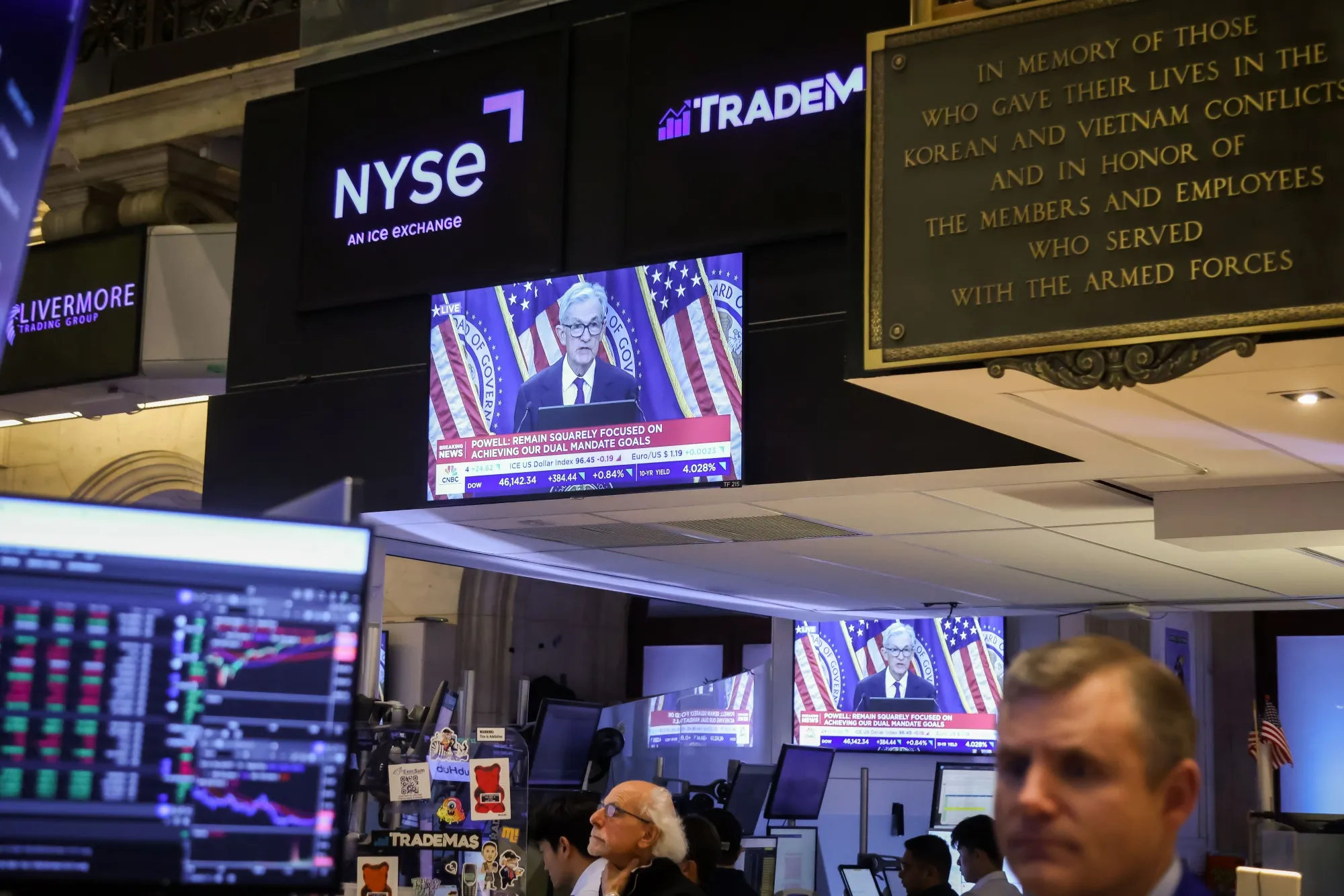 Television stations broadcast Jerome Powell speaking after an FOMC meeting on the floor of the New York Stock Exchange on Sept. 17.