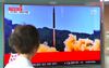 A newscast shows a North Korean missle launch on a television in Seoul in July.