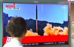A newscast shows a North Korean missle launch on a television in Seoul in July.
