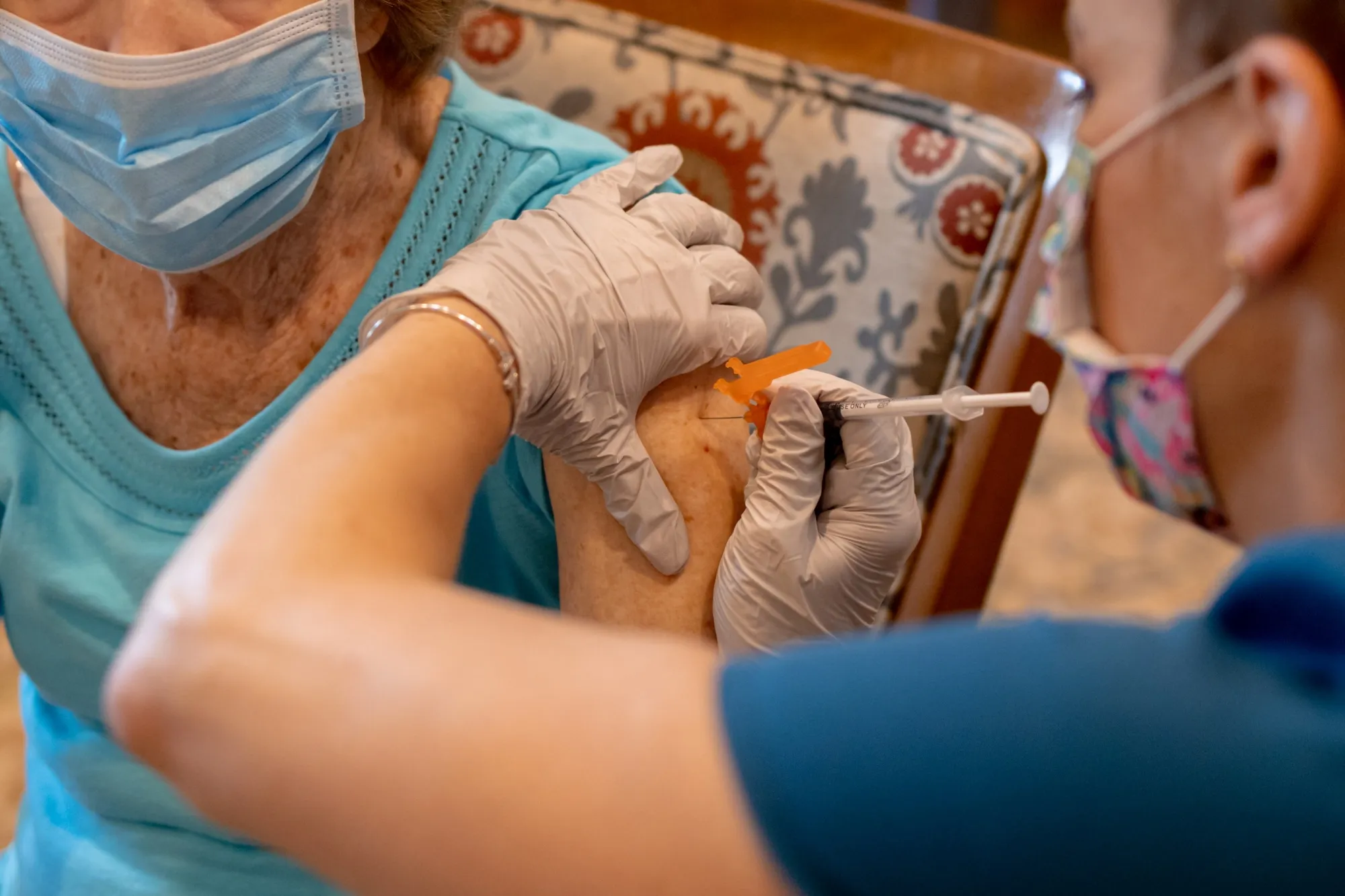 A Senior Living Facility Administers A Third Covid-19 Dose To Residents 