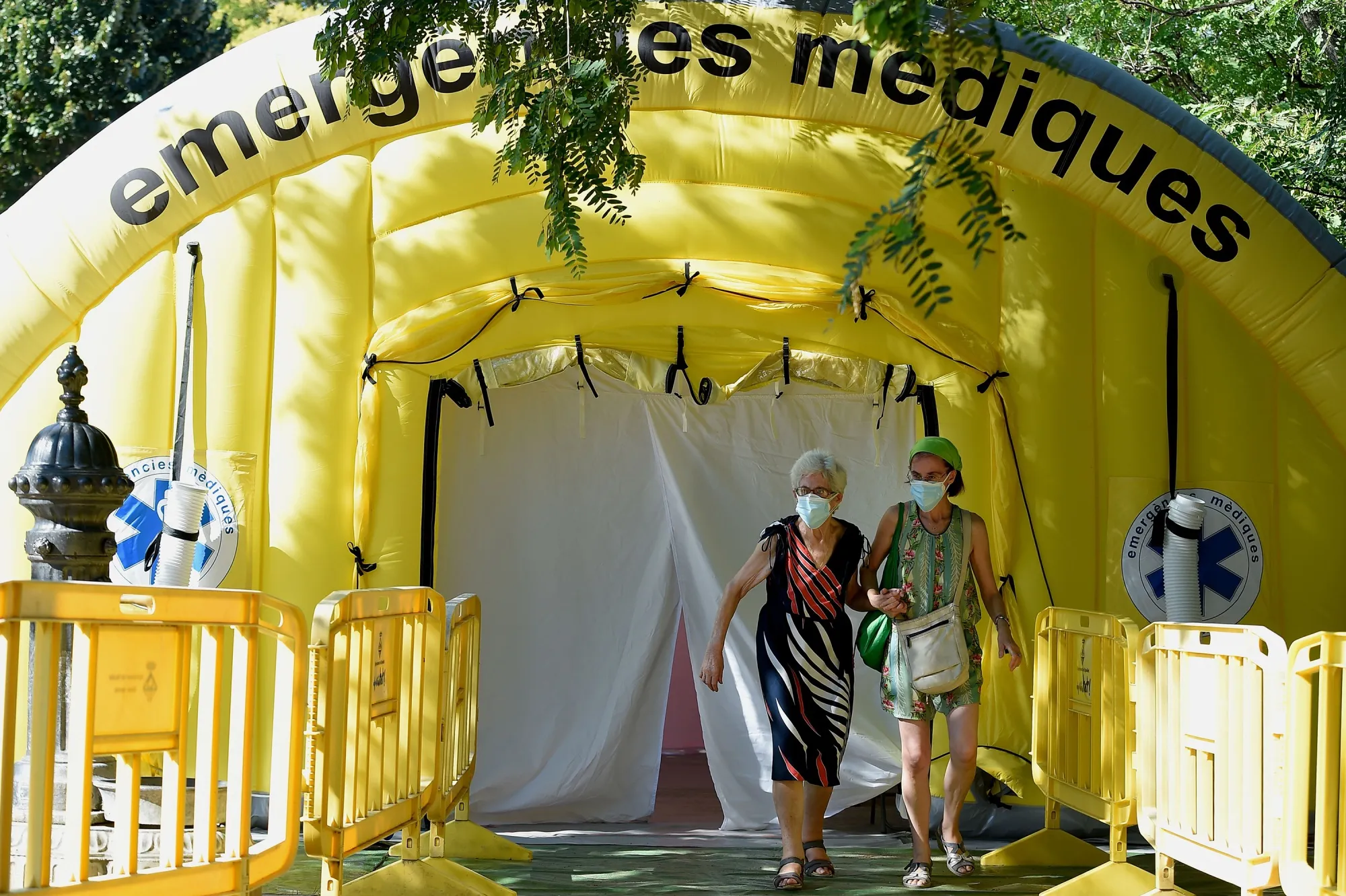 People wearing face masks leave a temporary&nbsp;Covid-19 testing center&nbsp;in Ripollet, Spain, on Aug. 6.