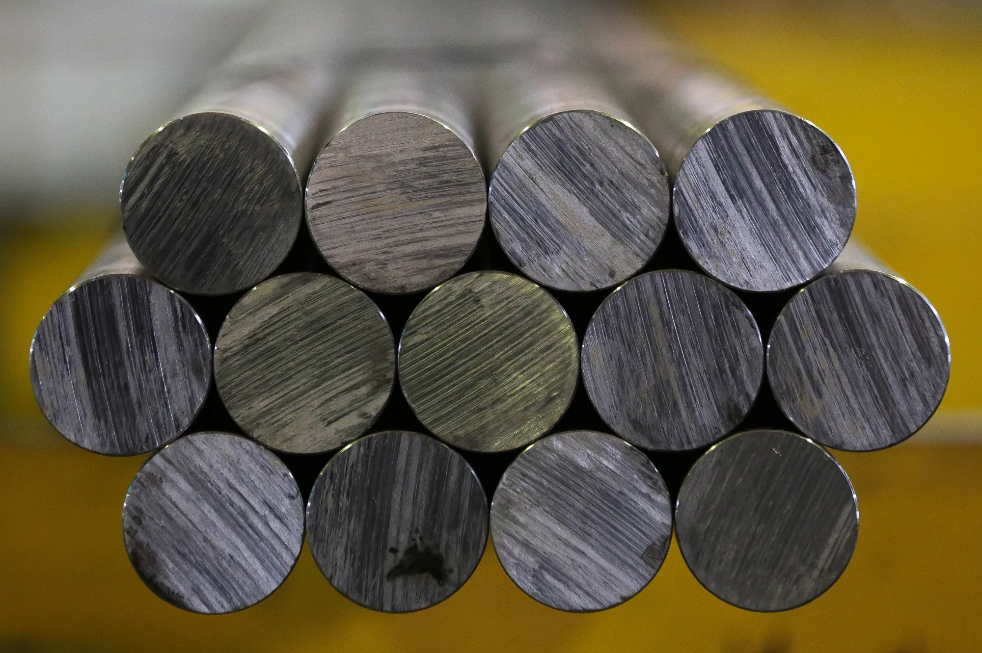 Lengths of rolled steel rods sit in storage ahead of distribution at the Oskol Elektrometallurgical Plant (OEMK) steel mill, operated by Metalloinvest Holding Co., in Stary Oskol, Russia, July 14, 2017. The new hot briquetted iron (HBI) production line at the Lebedinsky mine in Russia has an output capacity of 1.8m tons per year, a spokeswoman said by phone.