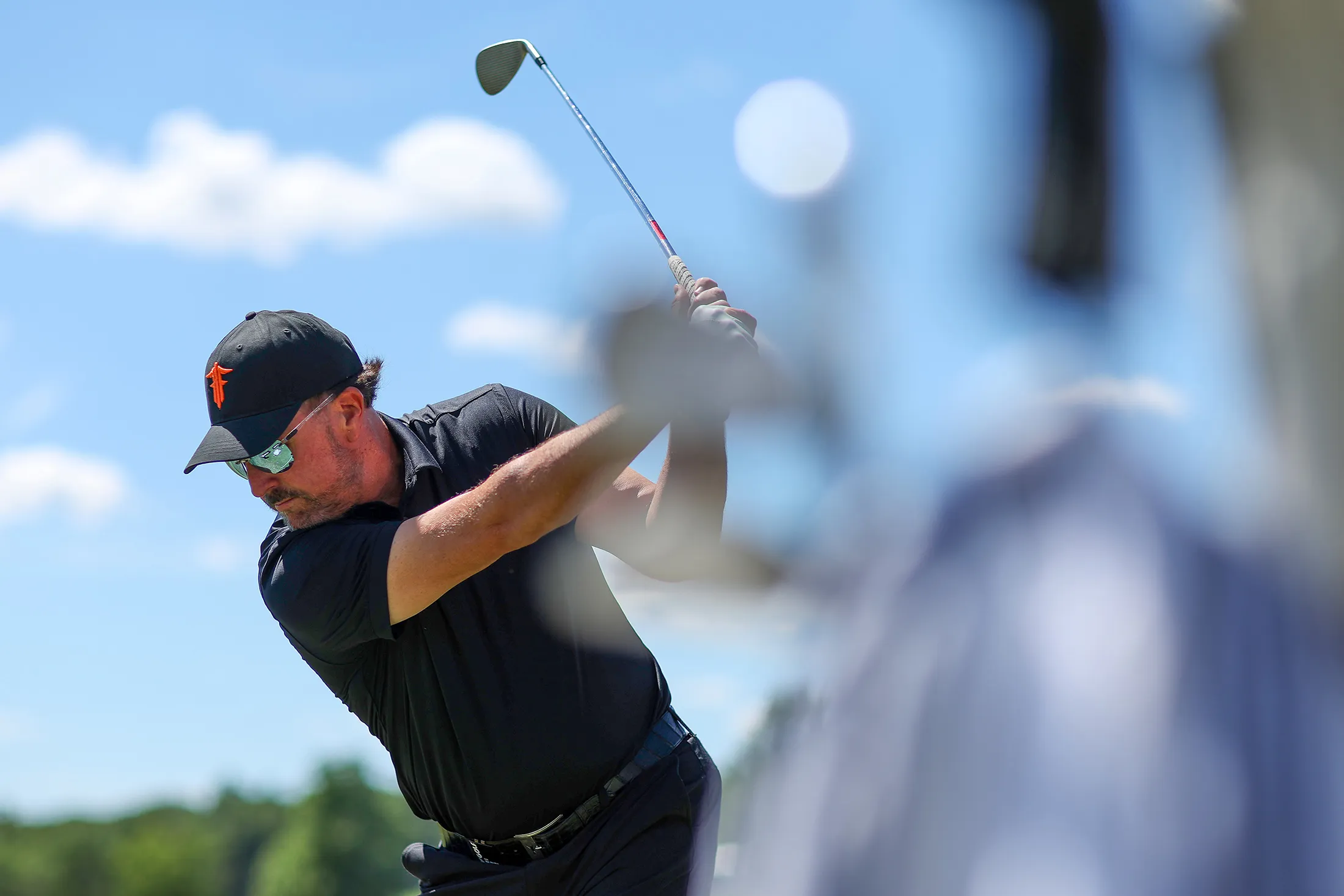 Phil Mickelson plays a shot on during day two of the LIV Golf Invitational - Bedminster.