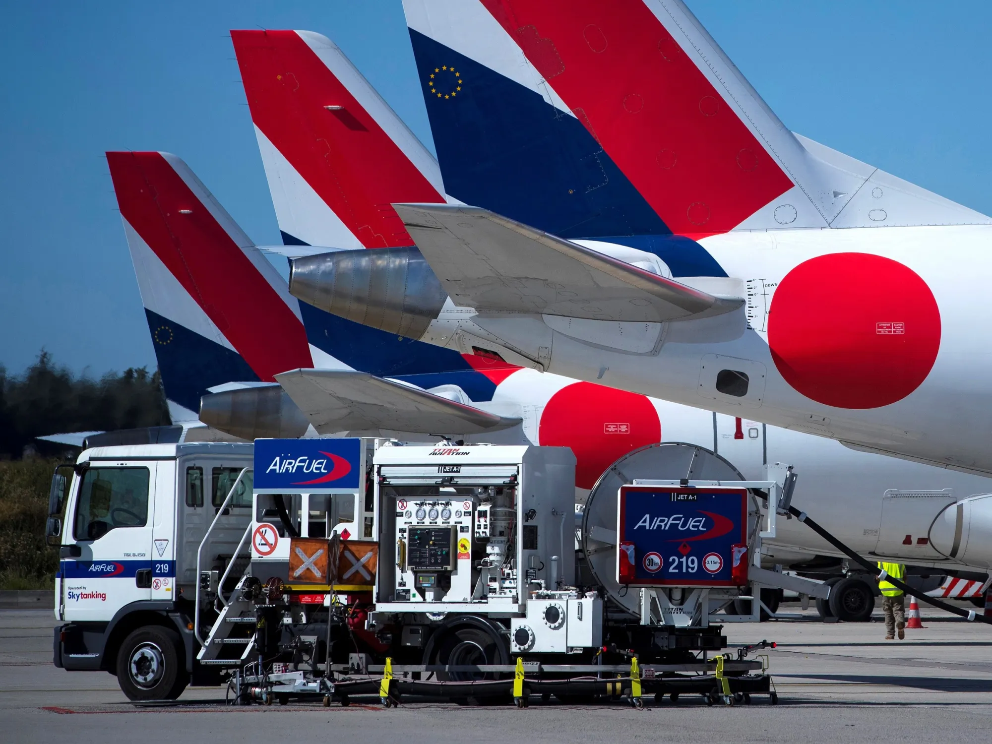Hop aircraft are refueled at Roissy-Charles de Gaulle Airport near Paris.