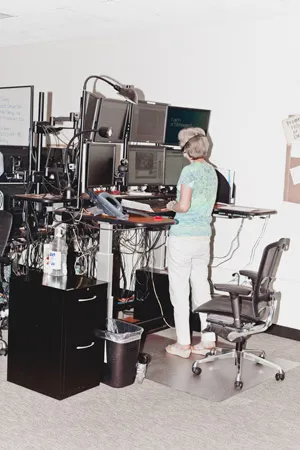 A nurse monitors several ERs at Steward’s EICU