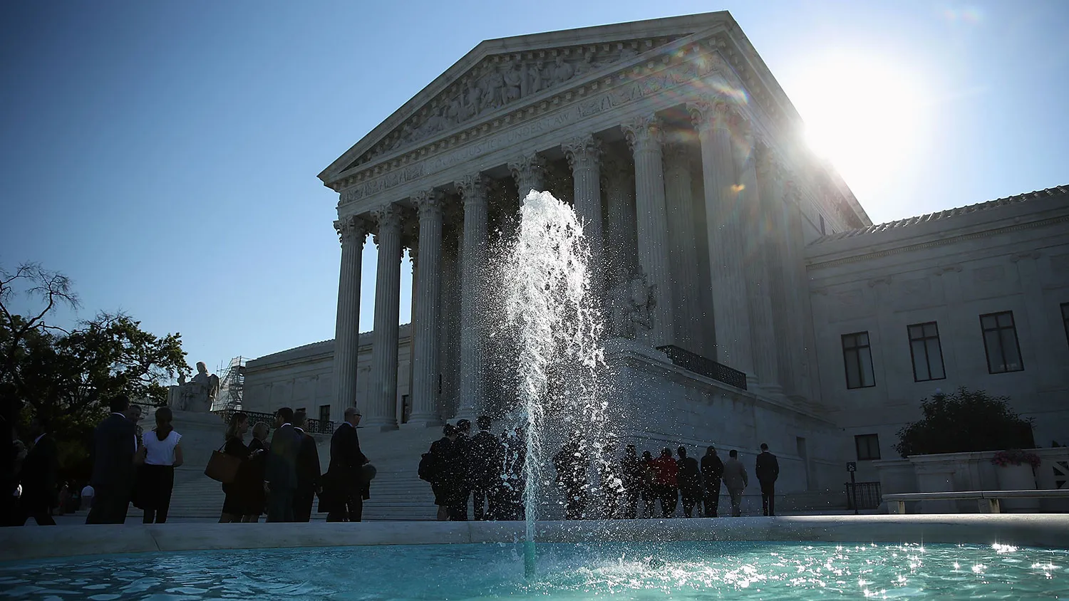 People wait in line to enter the U.S. Supreme Court building on June 20, 2016, in Washington.
