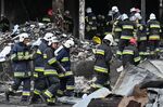 Firefighters attend the scene of a Russian airstrike in Vinnytsia, Ukraine, on July 14