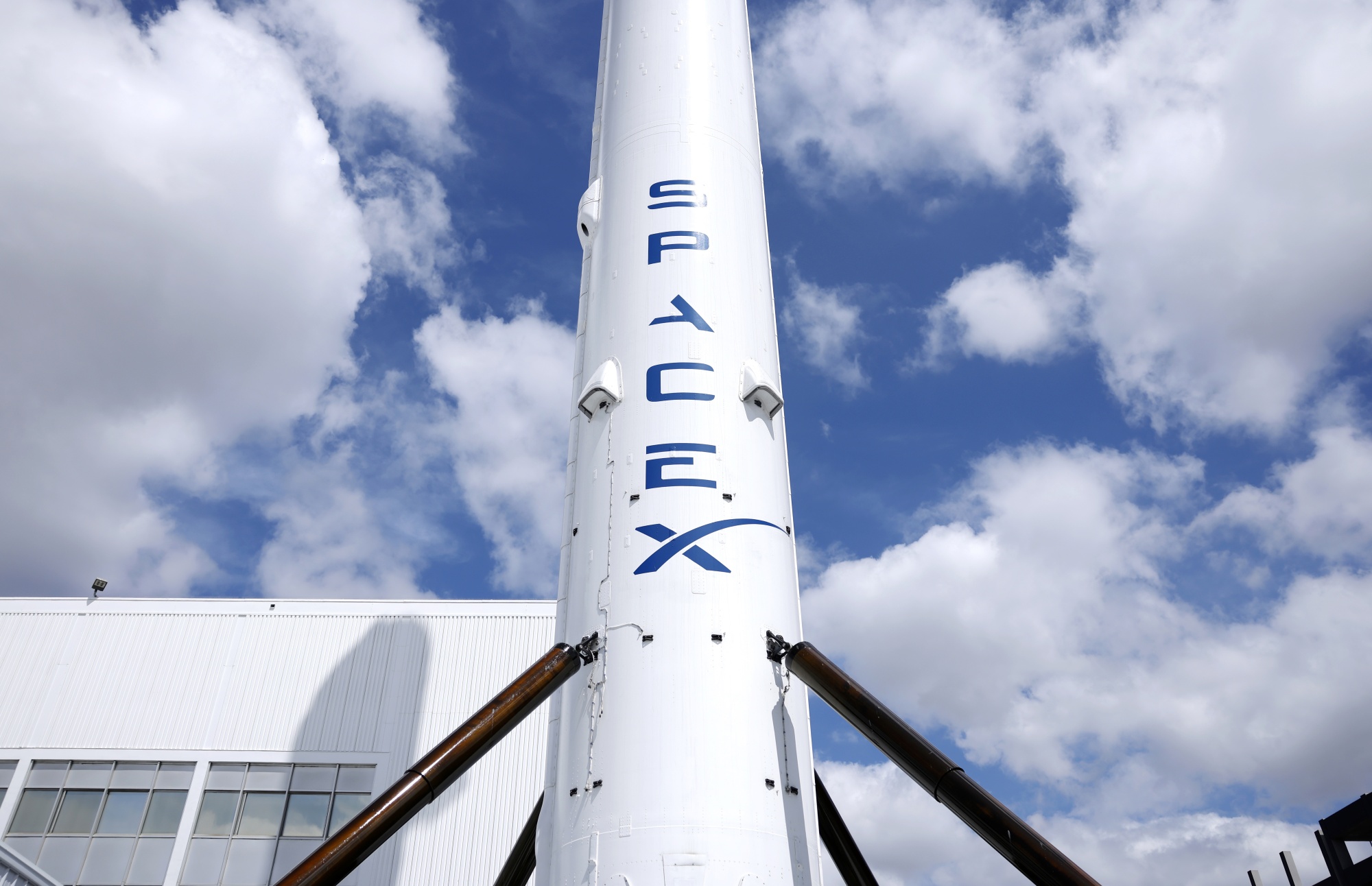HAWTHORNE, CALIFORNIA - APRIL 02: A SpaceX Falcon 9 rocket is displayed at a SpaceX facility on April 2, 2026 in Hawthorne, California. Elon Musk’s rocket and satellite company SpaceX has confidentially filed for an initial public offering (IPO) in what may be one of the largest public offerings in history. (Photo by Mario Tama/Getty Images)