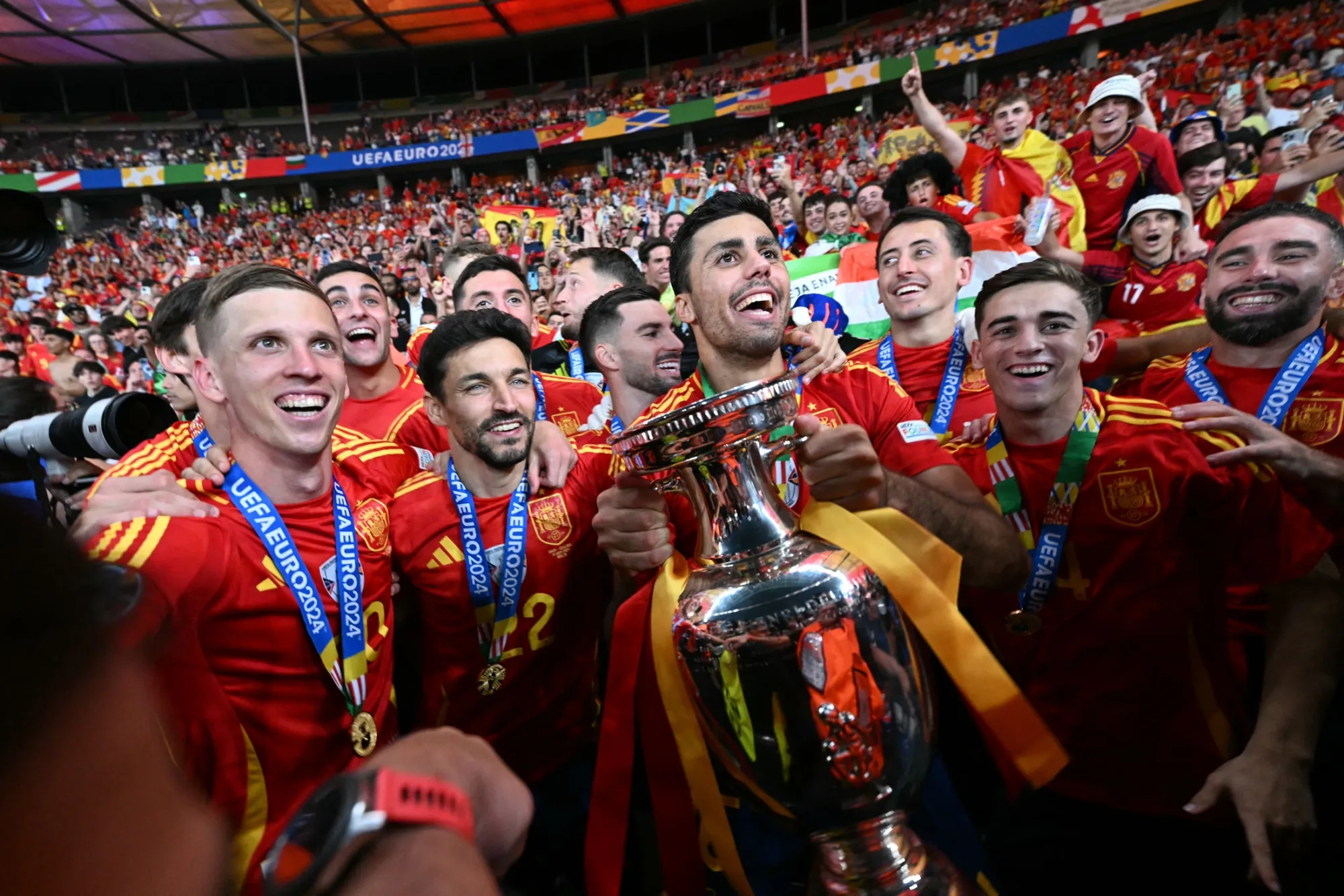 Spain's Rodri and teammates on a lap of honor with the trophy after winning the UEFA Euro 2024 final.
