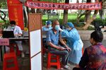 Elderly people line up to receive a dose of Covid-19 vaccine in Guangzhou, in May 2022.