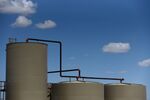 Separation tanks stand at a Colgate Energy LLC site in Reeves County, Texas, U.S., on Wednesday, Aug. 22, 2018. Spending on water management in the Permian Basin is likely to nearly double to more than $22 billion in just five years, according to industry consultant IHS Markit. Photographer: Callaghan O'Hare/Bloomberg