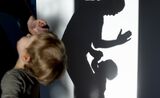 In this photo illustration a father is punishing his child