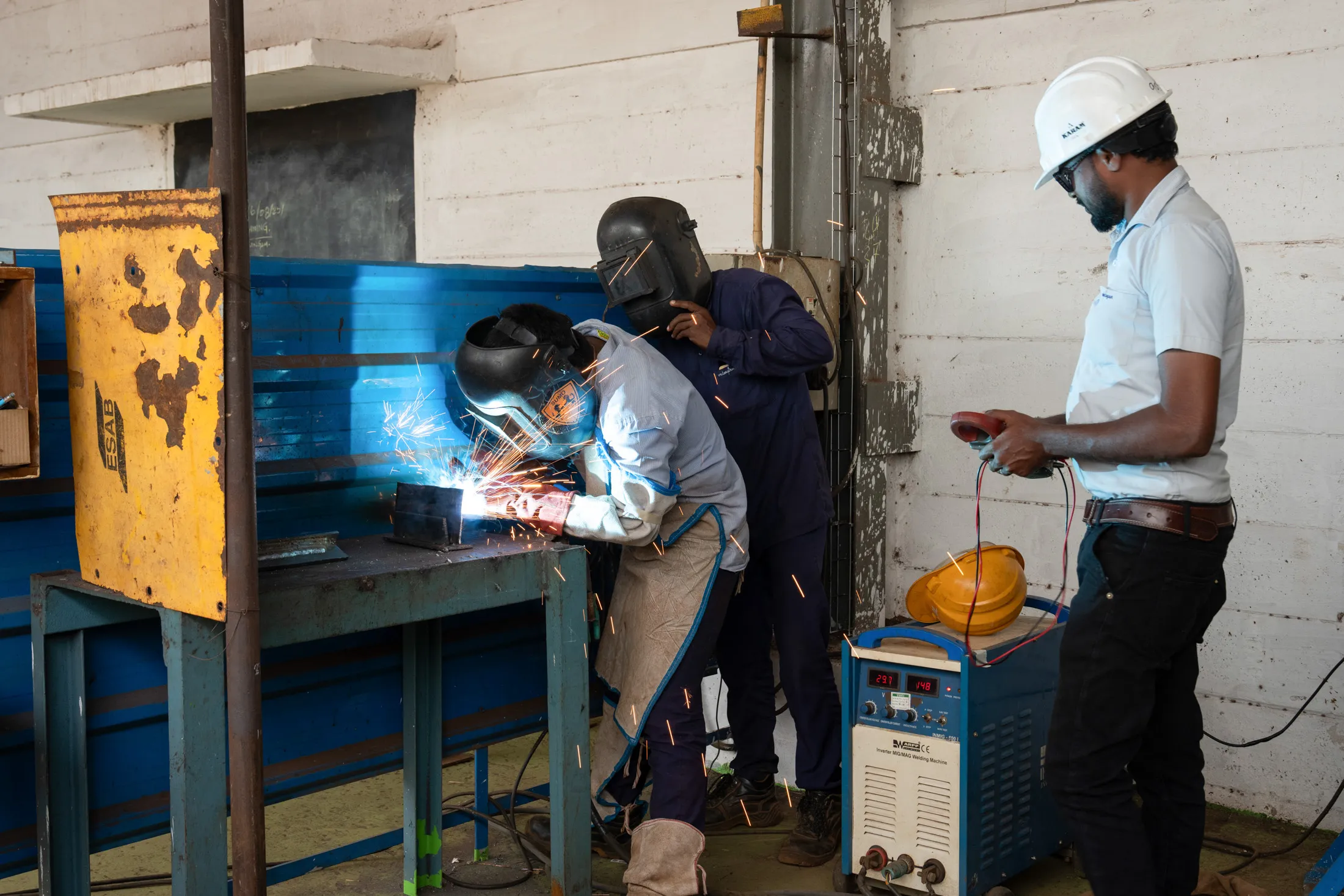 A manager&nbsp;trains new welders at a windmill tower business&nbsp;in Tiruchirappalli,&nbsp;Tamil Nadu,&nbsp;in August.