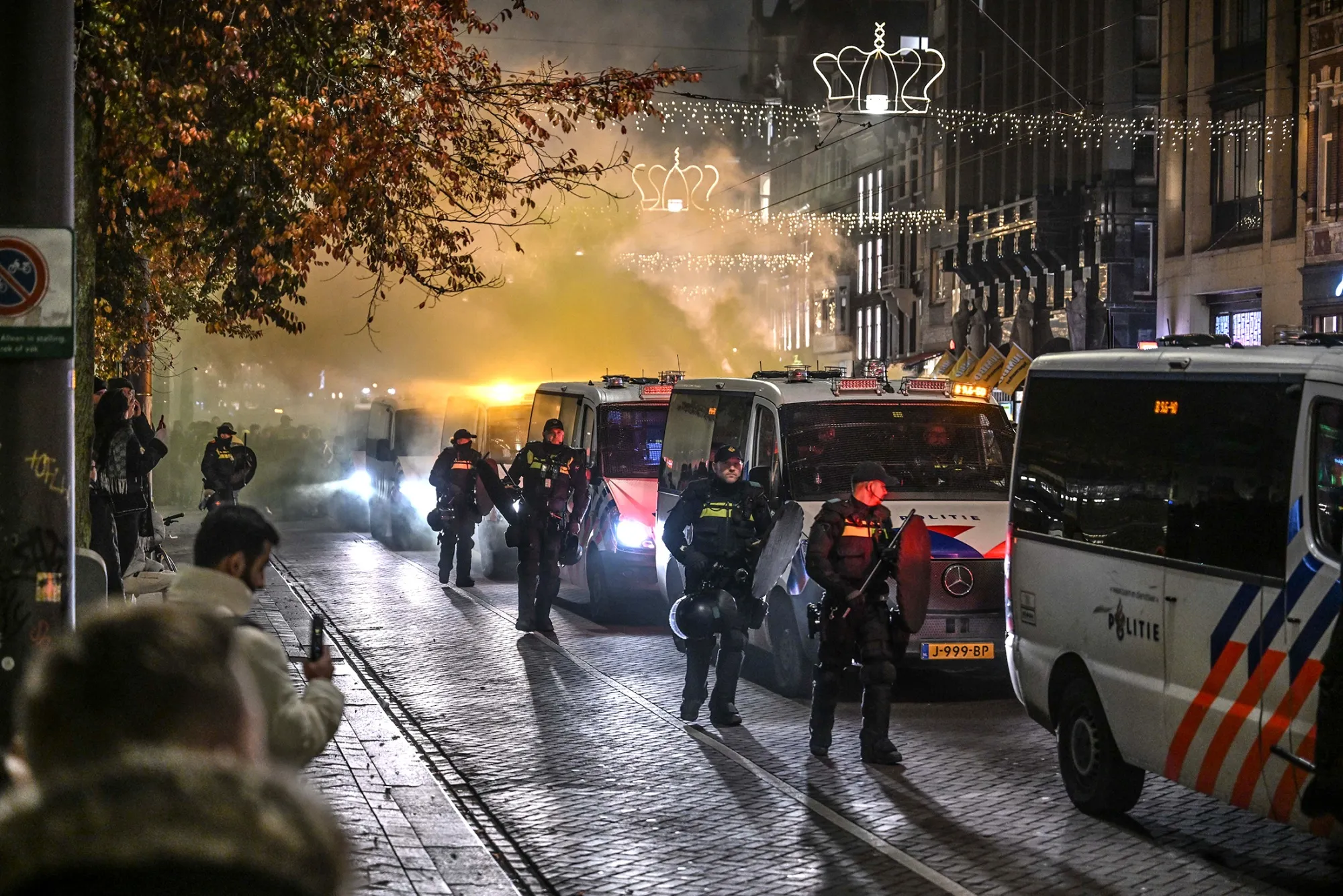 Police in Amsterdam monitor a pro-Israel demonstration staged by fans of football club Maccabi Tel Aviv ahead of the UEFA Europa League match, on Nov. 7.