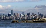 The city skyline is seen from the Spanish Banks in Vancouver, British Columbia, Canada.  Vancouver-based Nicola Wealth Management Ltd. tapped Robert Olsen as vice chair of its private capital team as the Canadian firm tries to build up a larger business in alternative assets.