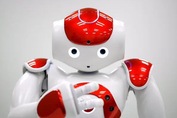 A NAO humanoid robot, developed by Softbank Corp. subsidiary Aldebaran Robotics SA, performs during a demonstration in Tokyo, Japan. Photographer: Kiyoshi Ota/Bloomberg
