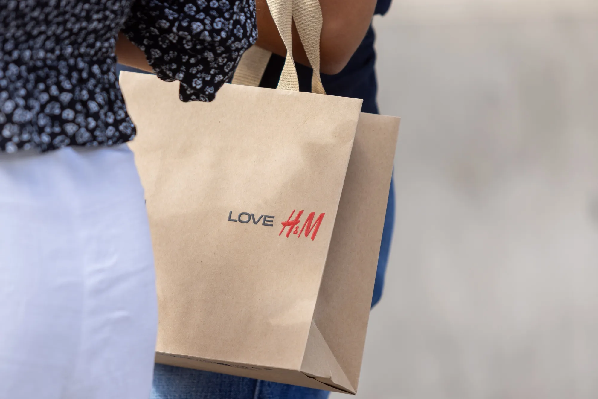 A shopper carries a H&M bag in London on Friday, Aug. 28, 2026.