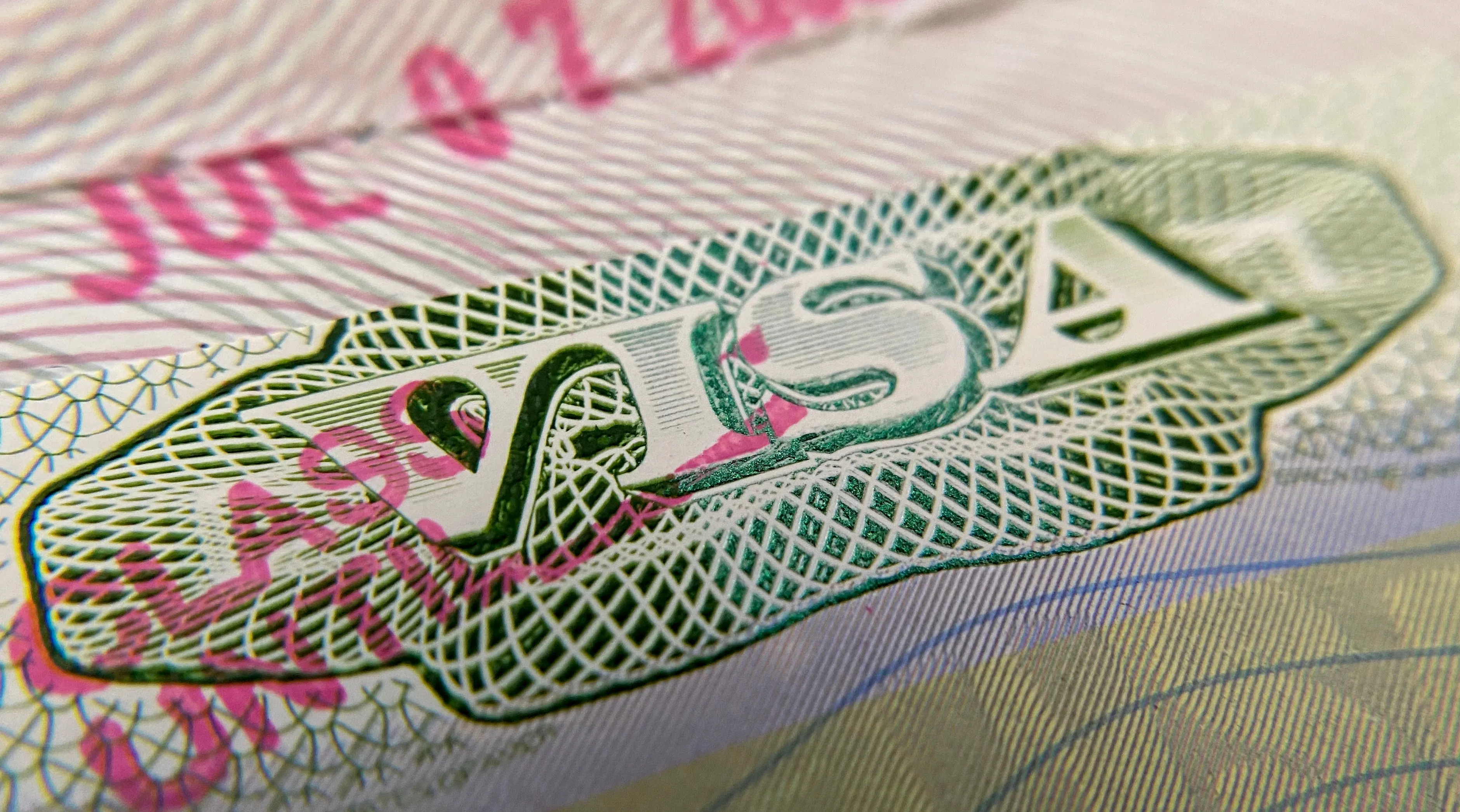 This photo illustration shows a visa stamp on a foreign passport in Los Angeles on June 6, 2020.