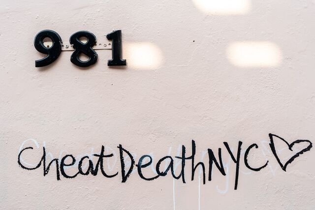 "Cheat Death NYC" graffiti first associated with bike messengers, after March referred to the pandemic, at 981 Broadway, Brooklyn