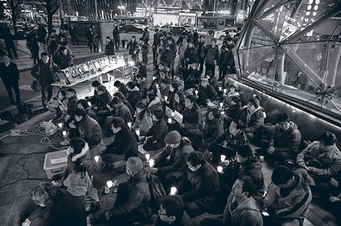 Workers’ families stage a protest at Samsung’s Seoul headquarters in 2013
