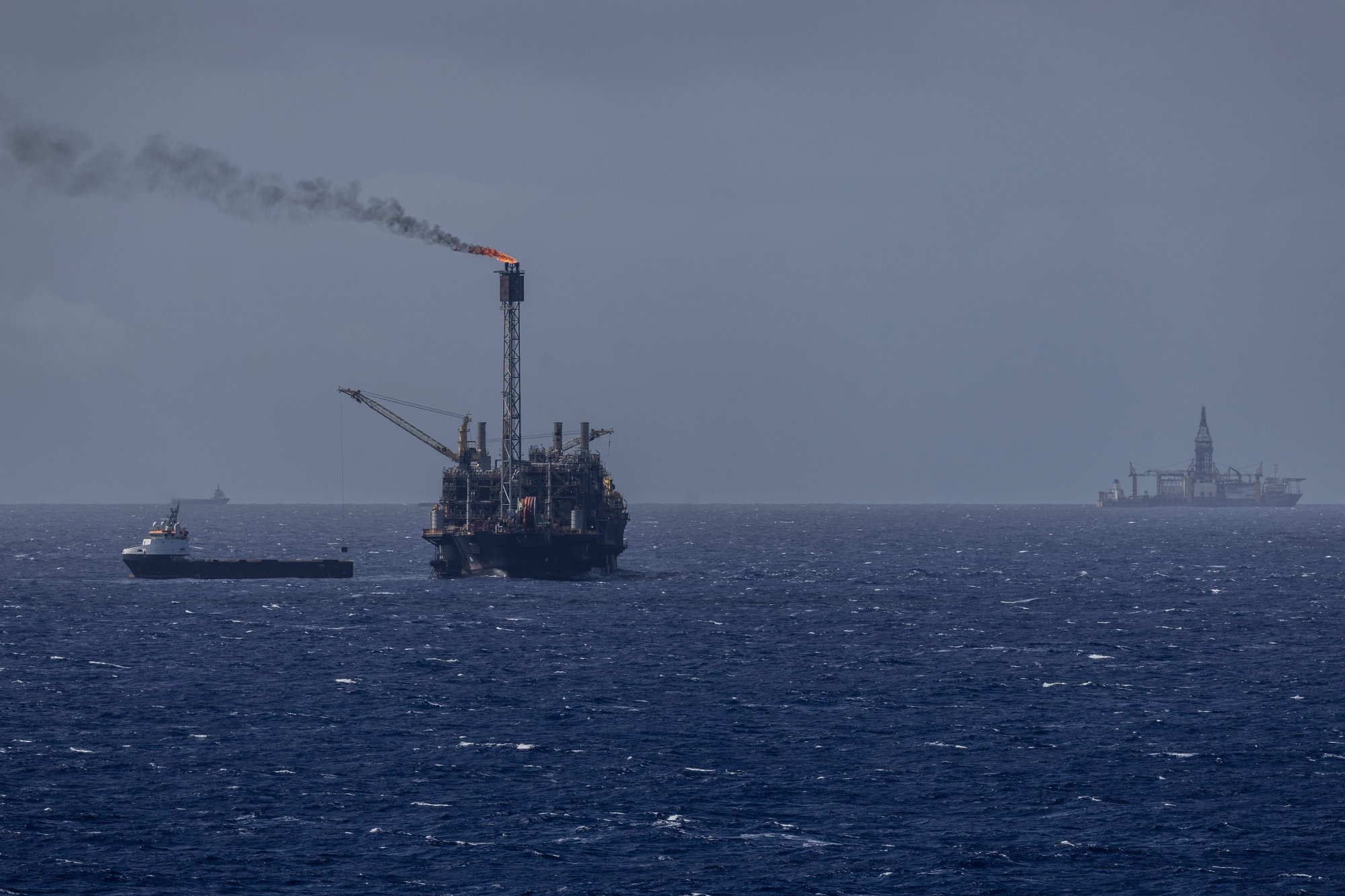 Floating Production, Storage, and Offloading (FPSO) vessels and supply vessels in the Buzios field off the coast of Rio de Janeiro, Brazil, on Friday, Oct. 24, 2025. Brazil's state oil company is accelerating production from the Buzios field as crude prices hover near a five-year low and the global market braces for glut.