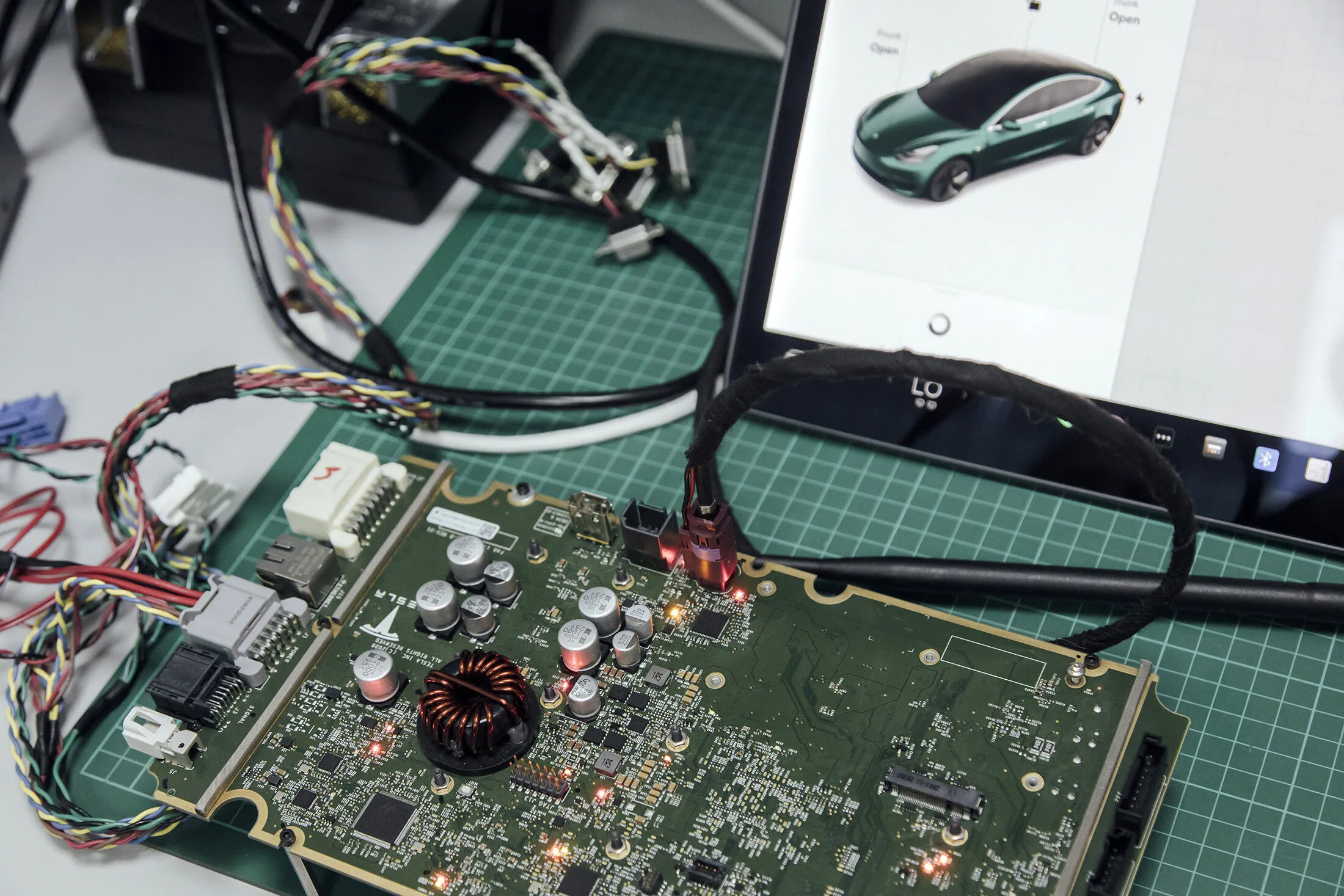 A Tesla&nbsp;motherboard&nbsp;in the hardware lab at Synacktiv headquarters in Paris.