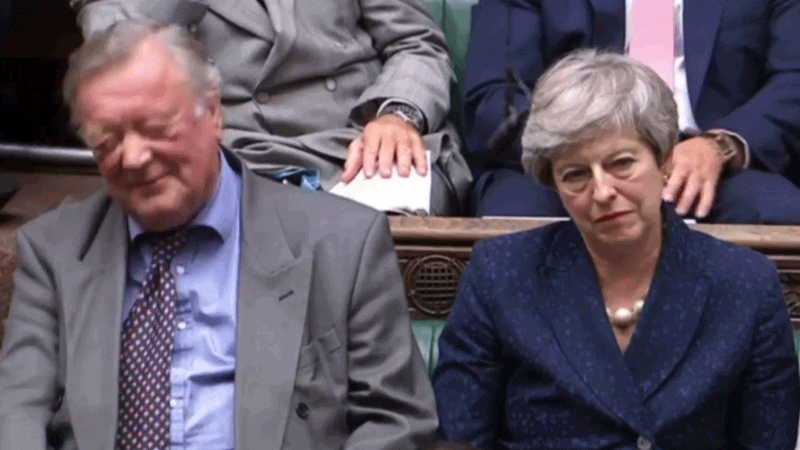 Theresa May laughs on Sept. 3.