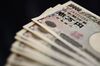 Japanese 10,000 yen banknotes are arranged for a photograph in Kawasaki City, Kanagawa Prefecture, Japan.