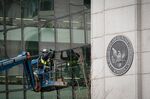 A construction worker outside the U.S. Securities and Exchange Commission headquarters in Washington, D.C.