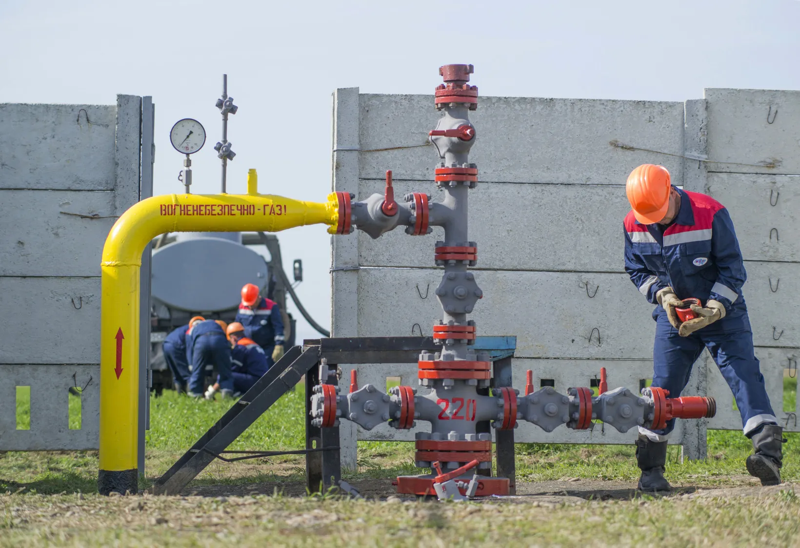 Employees work on gas pipes at an&nbsp;underground gas storage facility.