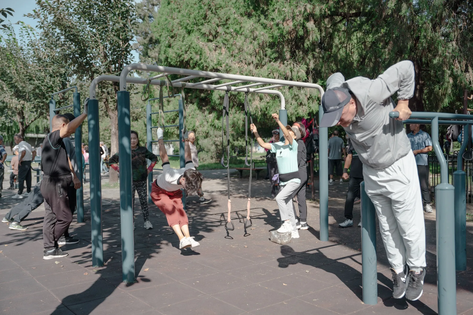 People exercise at a park in Beijing.