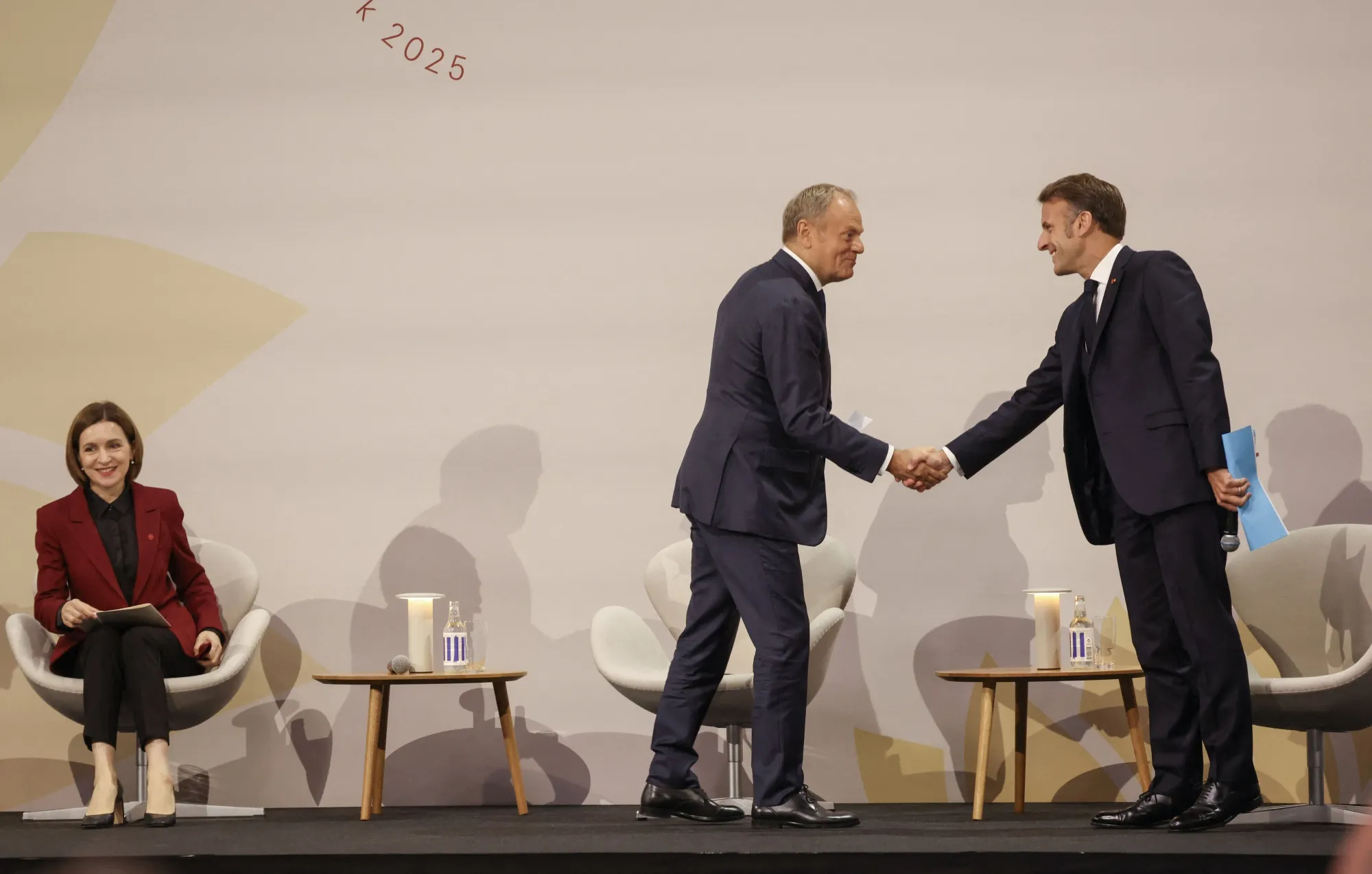 Maia Sandu, left, Donald Tusk and Emmanuel Macron, right, in Copenhagen, on Oct. 2.