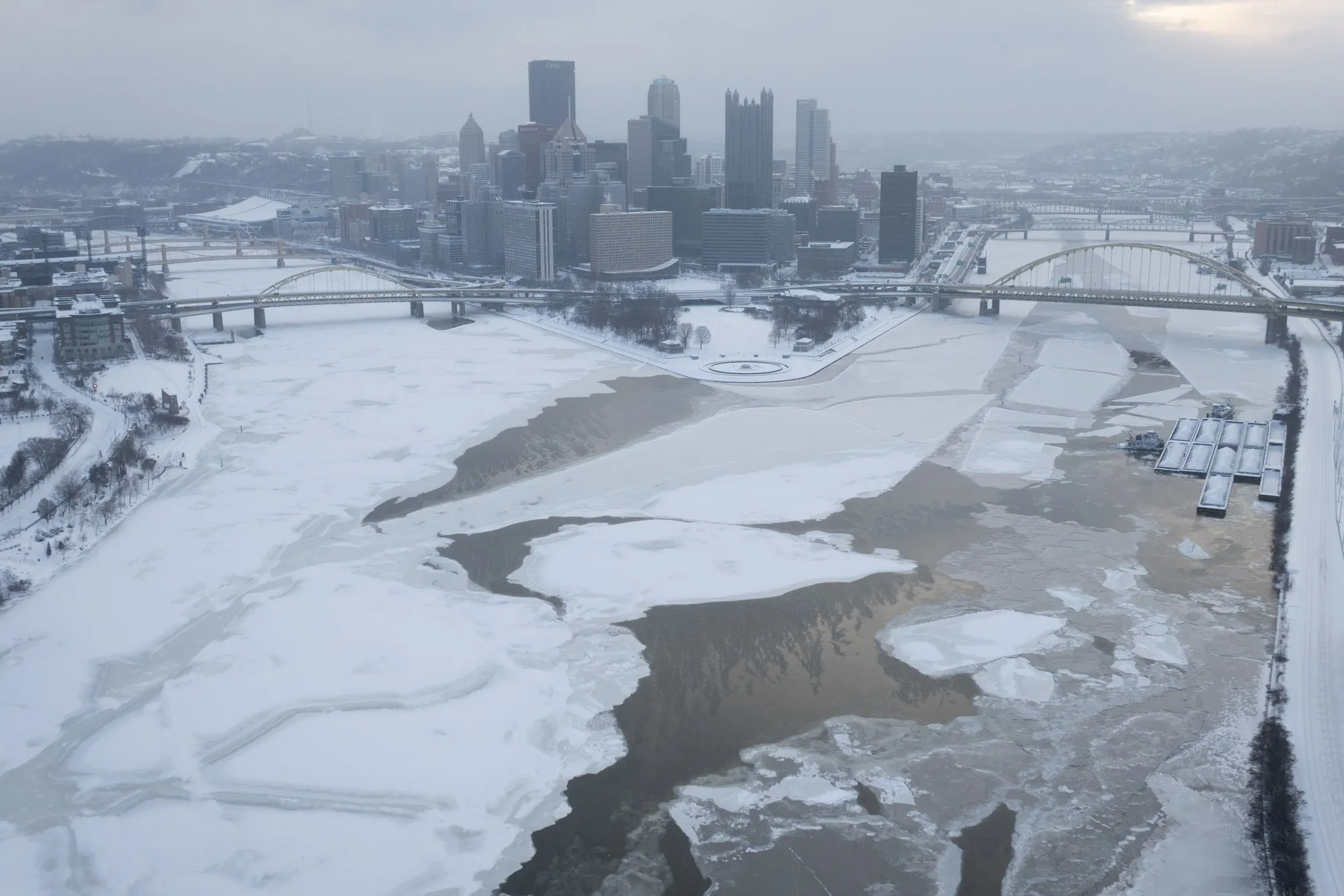 Ice sheets cover the rivers in downtown Pittsburgh.