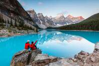 Couple looking at Moraine lake, Banff, Canada