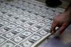 A 50 subject one dollar note sheet is inspected after receiving a serial number and the U.S. Treasury and U.S. Federal Reserve seals at the U.S. Bureau of Engraving and Printing in Washington, D.C., U.S., on Tuesday, April 14, 2015. Republican efforts to pass a fiscal year 2016 budget cleared another hurdle as the House named its members to a conference committee and Senate Majority Leader Mitch McConnell pledged to do the same by the end of the week.