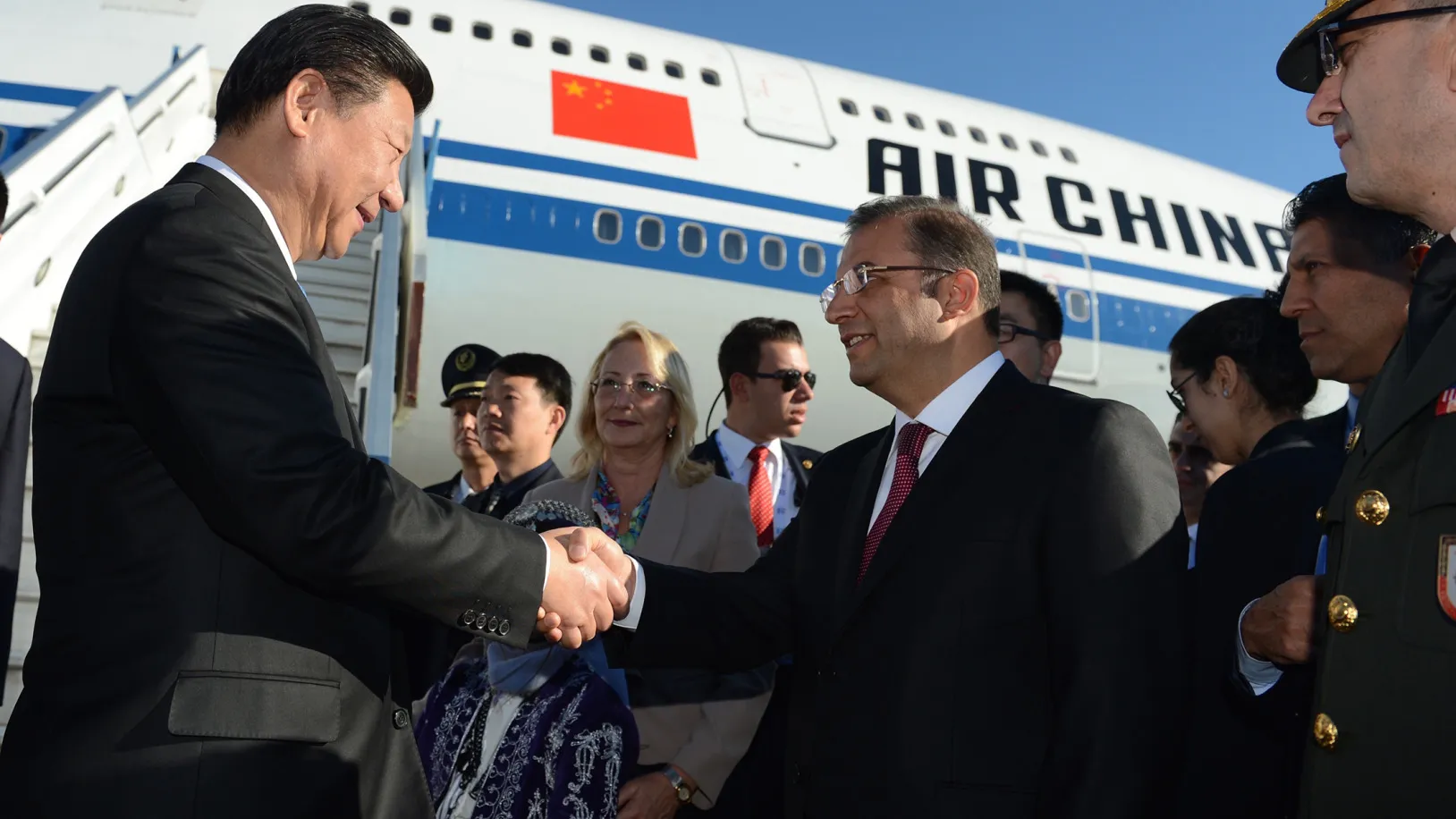 Chinese President Xi Jinping, left, arrives at the Antalya International Airport for the G20 Turkey Leaders Summit.
