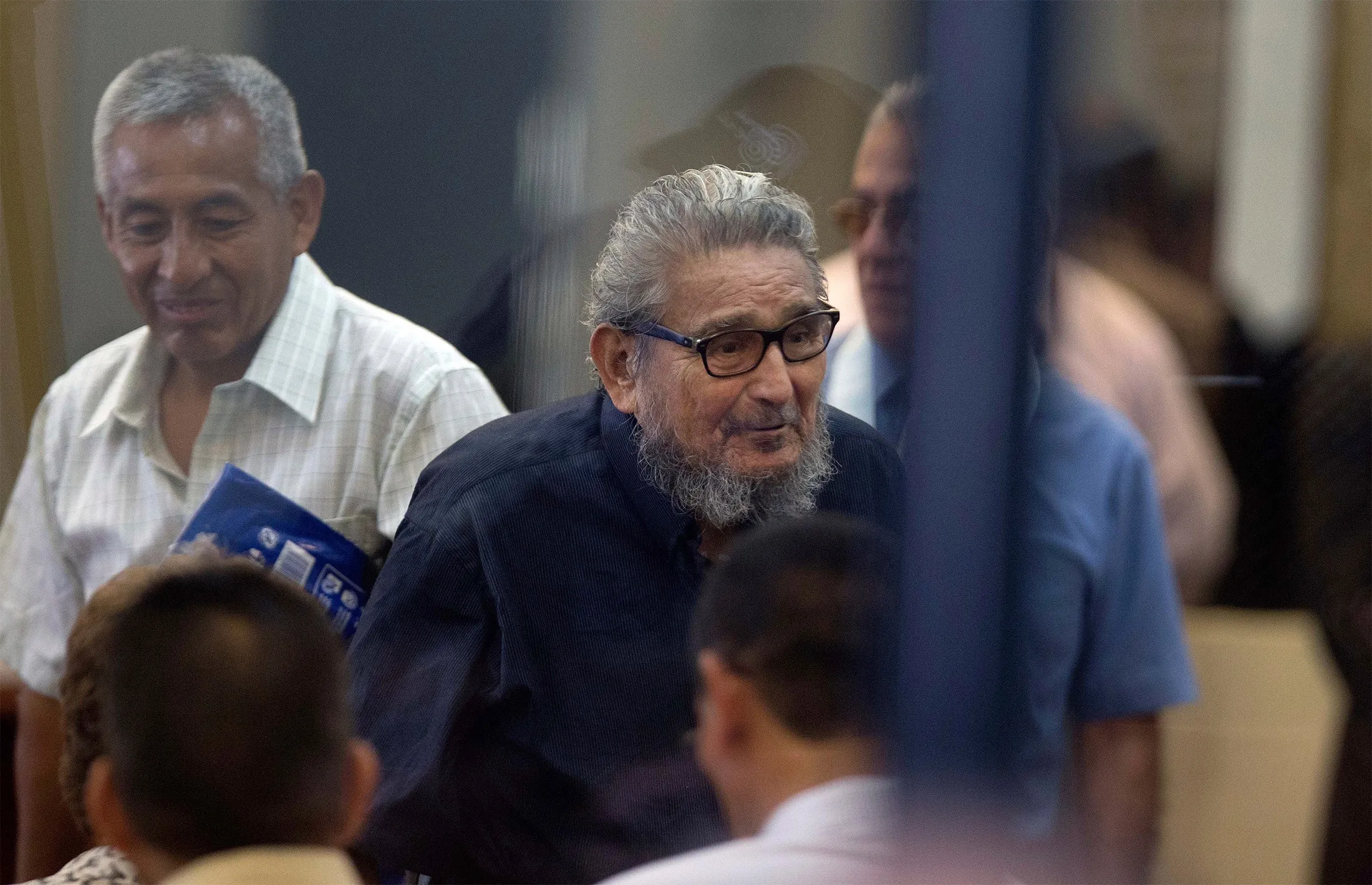 Abimael Guzman enters a courtroom at the Naval Base in Callao, Peru, in 2017.