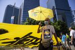 Demonstrators display a banner during a protest outside the Legislative Council building in Hong Kong, China, on Wednesday, Oct. 16, 2019.